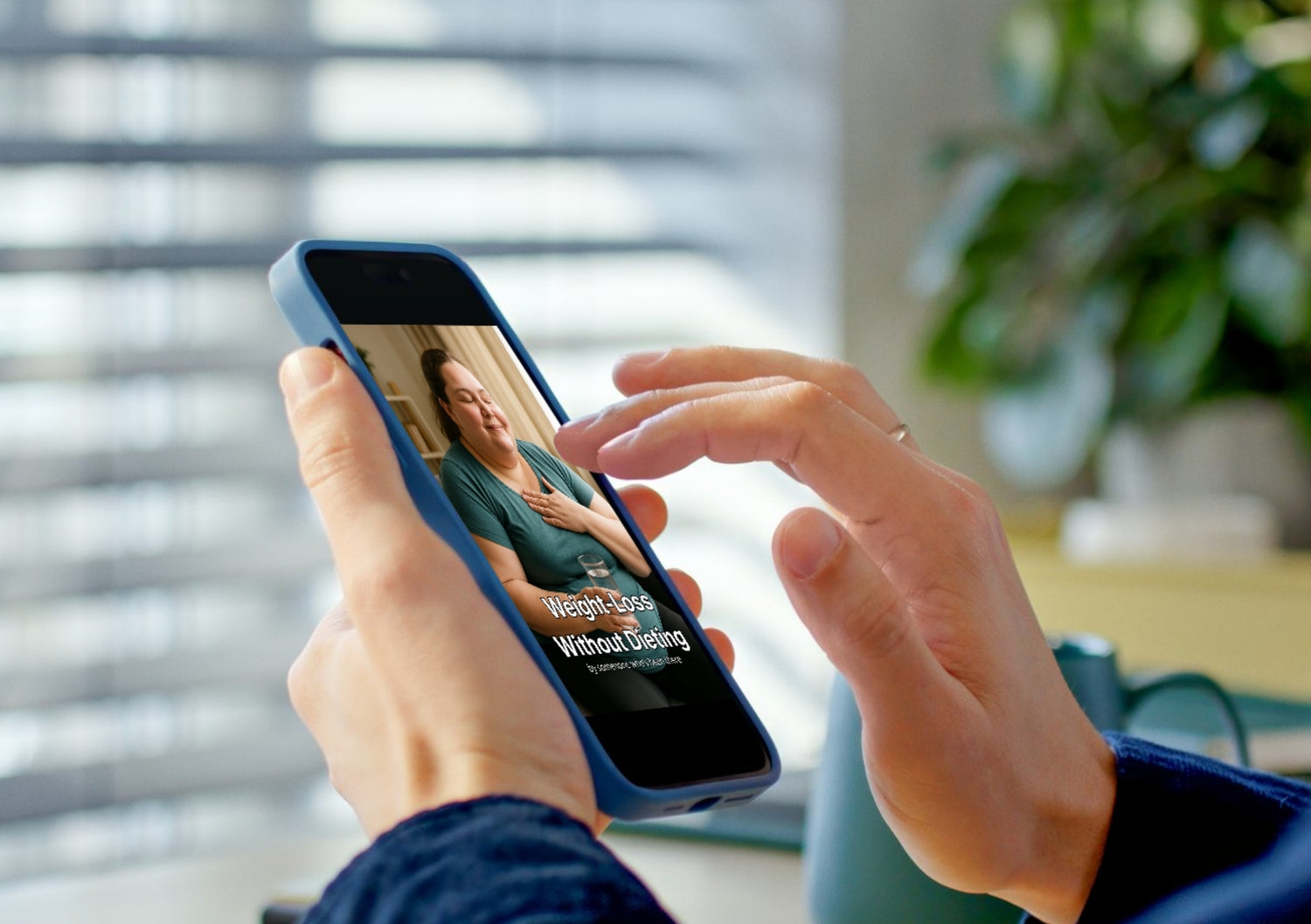 Person using a smartphone with weight loss without dieting on screen, blurred indoor background